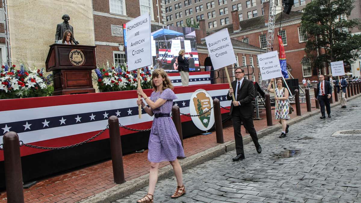 Participants reenact the 1965 picket for LGBT rights at Philadelphia's 4th of July celebration of the 50th anniversary of the LGBT civil rights movement. (Kimberly Paynter/WHYY)