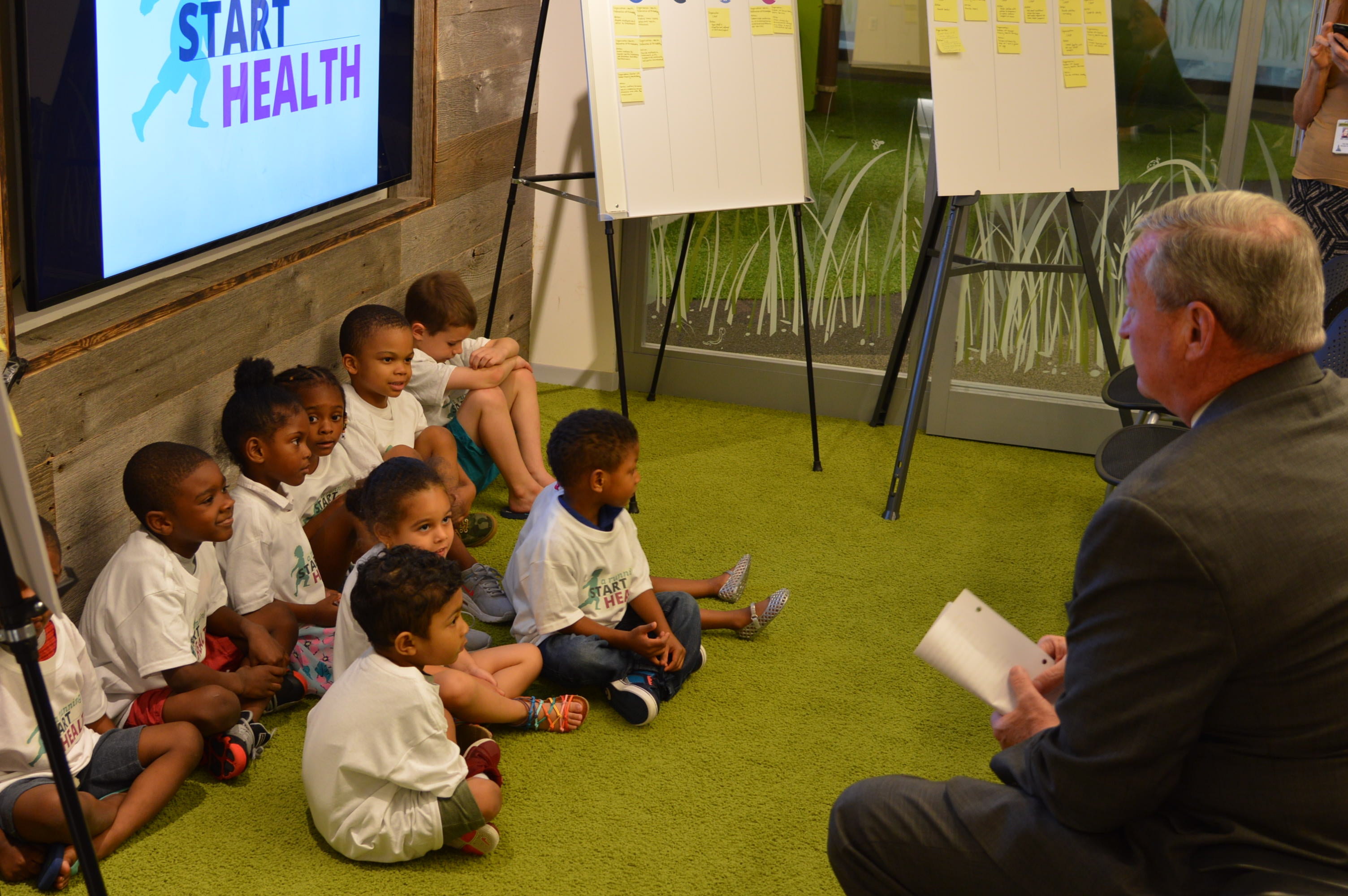 Mayor Jim Kenney speaks with children before announcing the new health initiative.
