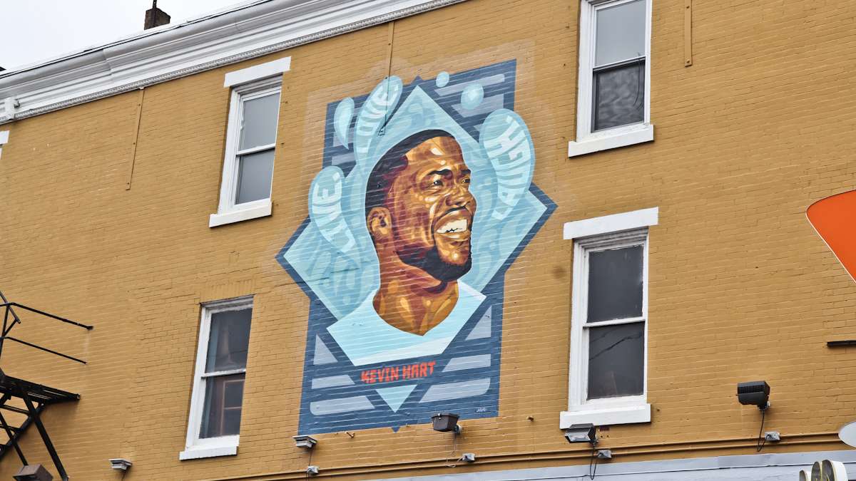 Kevin Hart fans gather to celebrate the comedian on his birthday at the site of the new mural of his likeness at Germantown Ave. and Erie Ave. in North Philadelphia.