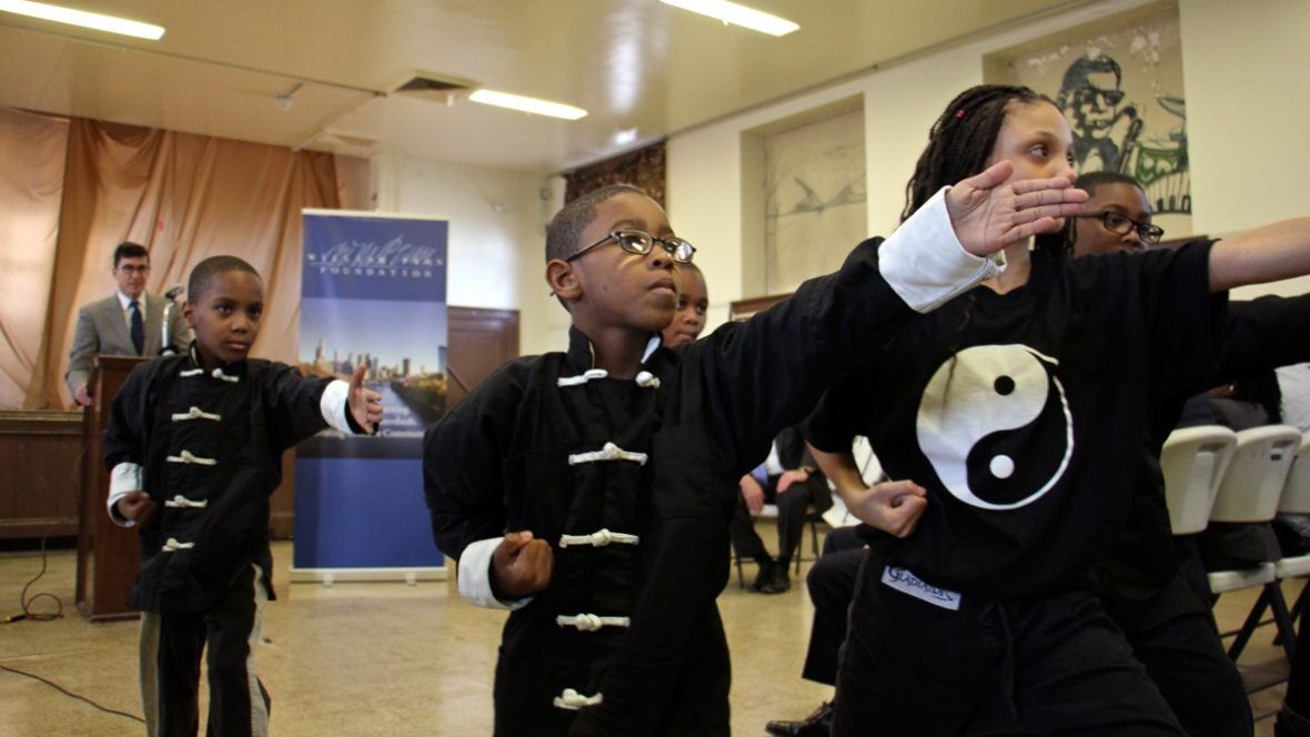  As Philadelphia managing director Michael DiBerardinis looks one, Students of Cecil B. Moore Recreation Center perform during the announcement of a $100 million grant from the William Penn Foundation to improve public spaces in Philadelphia. (Emma Lee/WHYY) 