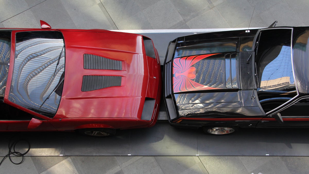  Two muscle cars collide in slow motion in the lobby of the Kimmel Center, one of several works of art from the West Collection on display to celebrate the opening of the SEI Innovation Studio. (Emma Lee/for NewsWorks) 