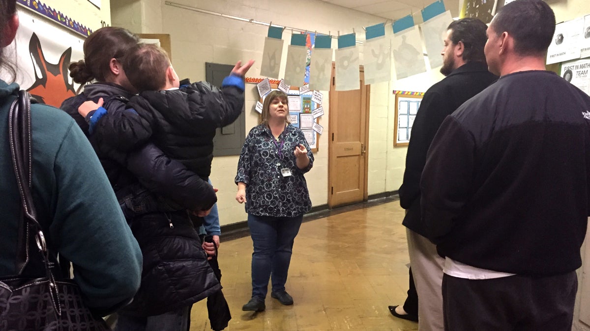  Kelly Stacey leads prospective kindergarten parents on a tour of Fox Chase school. (Avi Wolfman-Arent/WHYY) 