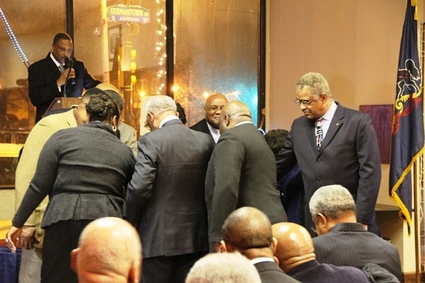 <p><p>Rev. Dr. Bruce W. Petty, Sr. leads clergy members in a circle of prayer for state. Rep. Stephen Kinsey. (TrenaeV.McDuffie/for Newsworks)</p></p>
