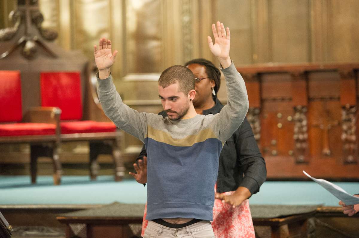 Members of Up Against The Law Legal Collective demonstrate police limitations when frisking detainees at a know-your-rights training at the First Unitarian Church of Philadelphia.