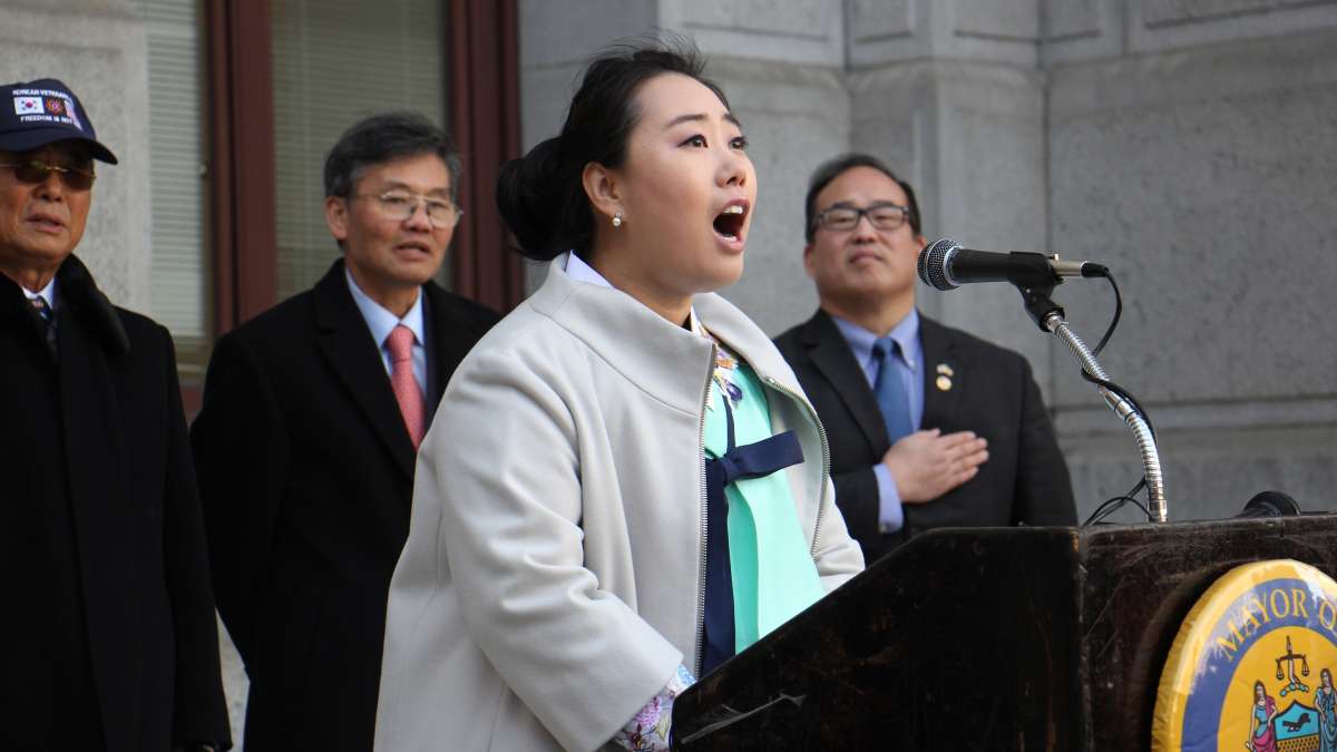 Ji Hyun Choe of the Society of Young Korean Americans sings ''The Star Spangled Banner'' during a ceremony outside City Hall during the celebration of Korean American Day.