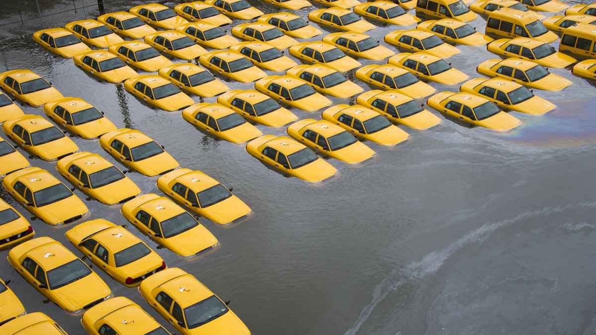  Flooded taxis in Hoboken the morning after Superstorm Sandy hit NJ/NY. (AP File Photo/Charles Sykes) 