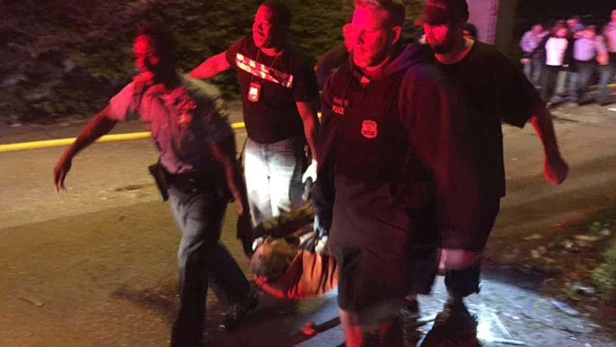 A passenger is carried following an Amtrak train crash Tuesday, May 12, 2015, near Philadelphia. Train 188 was traveling from Washington to New York City.