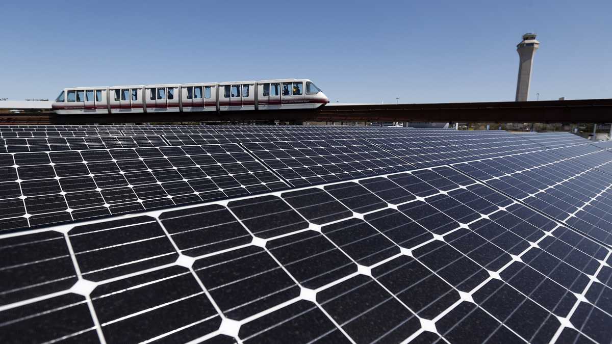  Solar panels on the roof of the building supplying energy to the AirTrain at Newark Liberty International Airport soak up the rays. (AP file photo) 