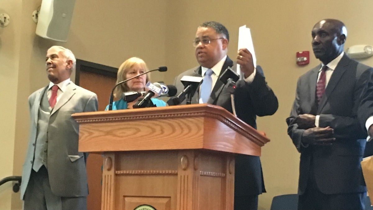  During a February press conference, Rev. Christopher Bullock holds a letter to U.S. Attorney General Jeff Sessions asking for a federal investigation into Delaware prisons. (Mark Eichmann/WHYY) 