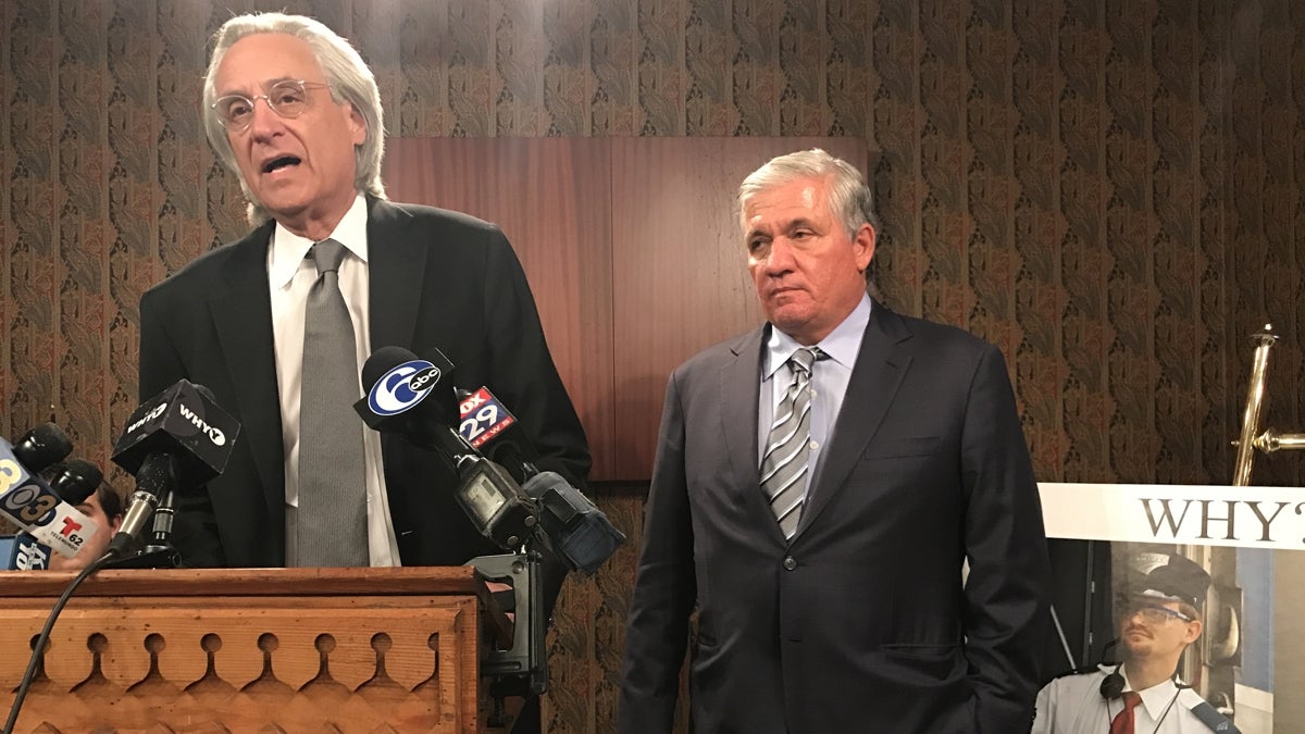  Representing crash victims, attorneys Thomas Kline (left) and Robert Mongeluzzi address reporters at a news conference on Thursday next to a photo of Amtrak 188 engineer Brandon Bostian. Pennsylvania Attorney General Josh Shapiro has charged Bostian causing a catastrophe, eight counts of involuntary manslaughter and other crimes. (Bobby Allyn/WHYY) 