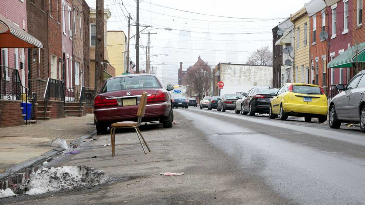 Cars are parked along a street in Philadelphia. (Nathaniel Hamilton/for NewsWorks) 