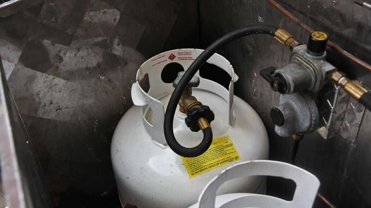  Propane tanks stored in a side compartment of a food truck. (Kimberly Paynter/WHYY) 