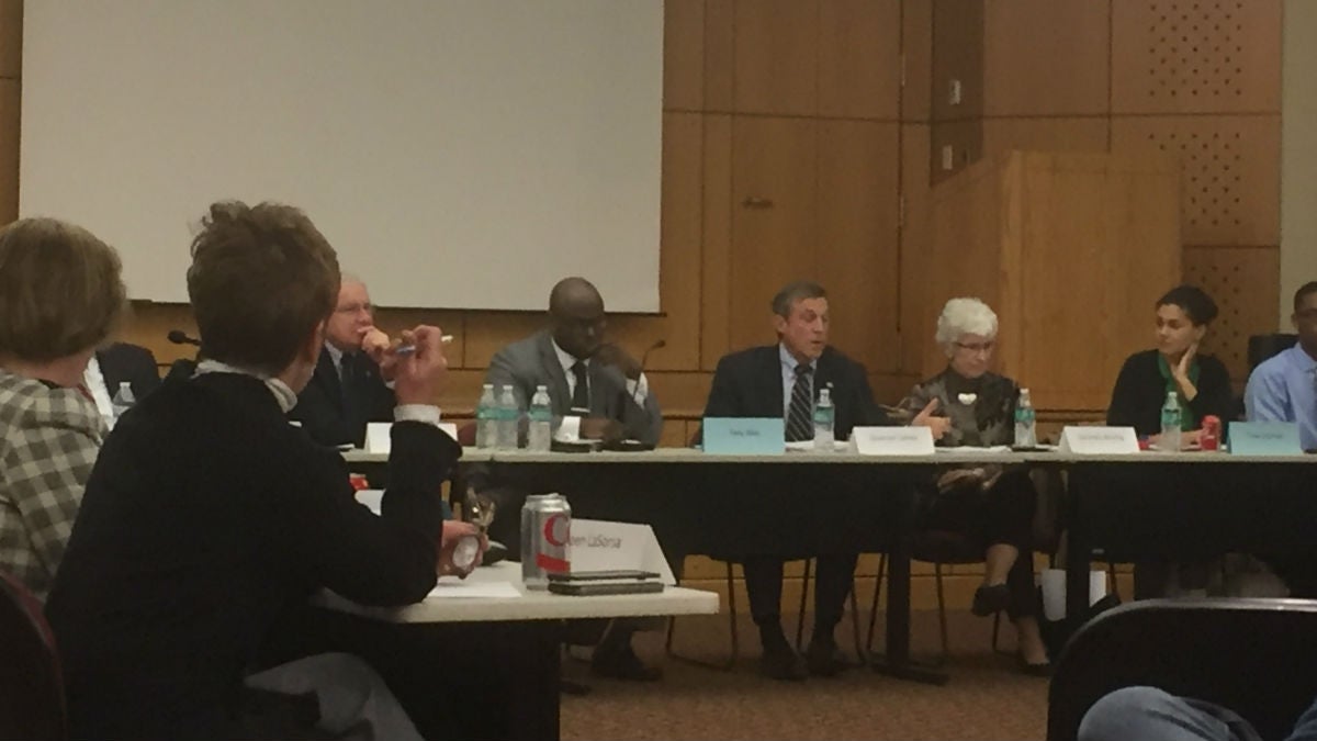  Gov. Carney (speaking, center) has directed education secretary Susan Bunting (seated next to him) to draft anti-bias guidelines to protect Delaware's 137,000 public school students. (Zoey Read/WHYY) 