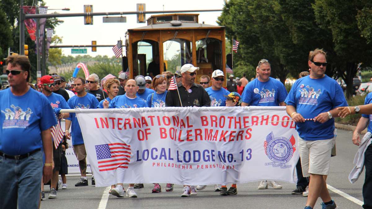 Members of the International Brotherhood of Boilermakers march in the Labor Day parade down Columbus Boulevard in Philadelphia. (Emma Lee/WHYY)