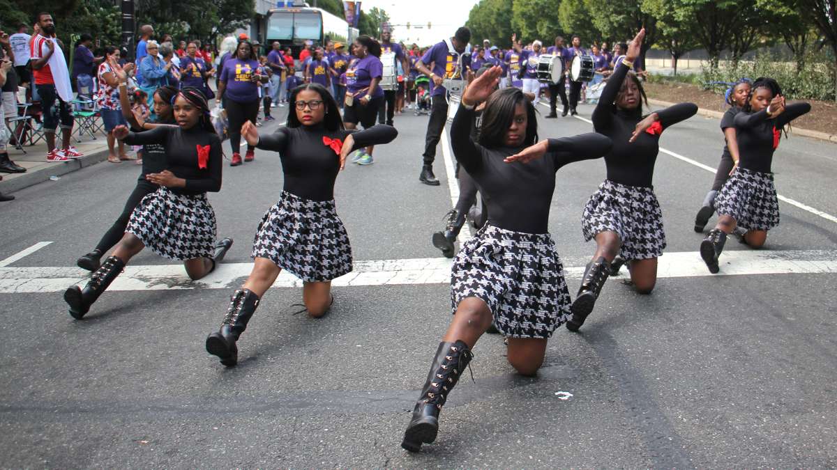 Members of the Finest Drill Team and Drum Corps perform in the Philadelphia Labor Day parade, leading the Service Employees International Union. (Emma Lee/WHYY)