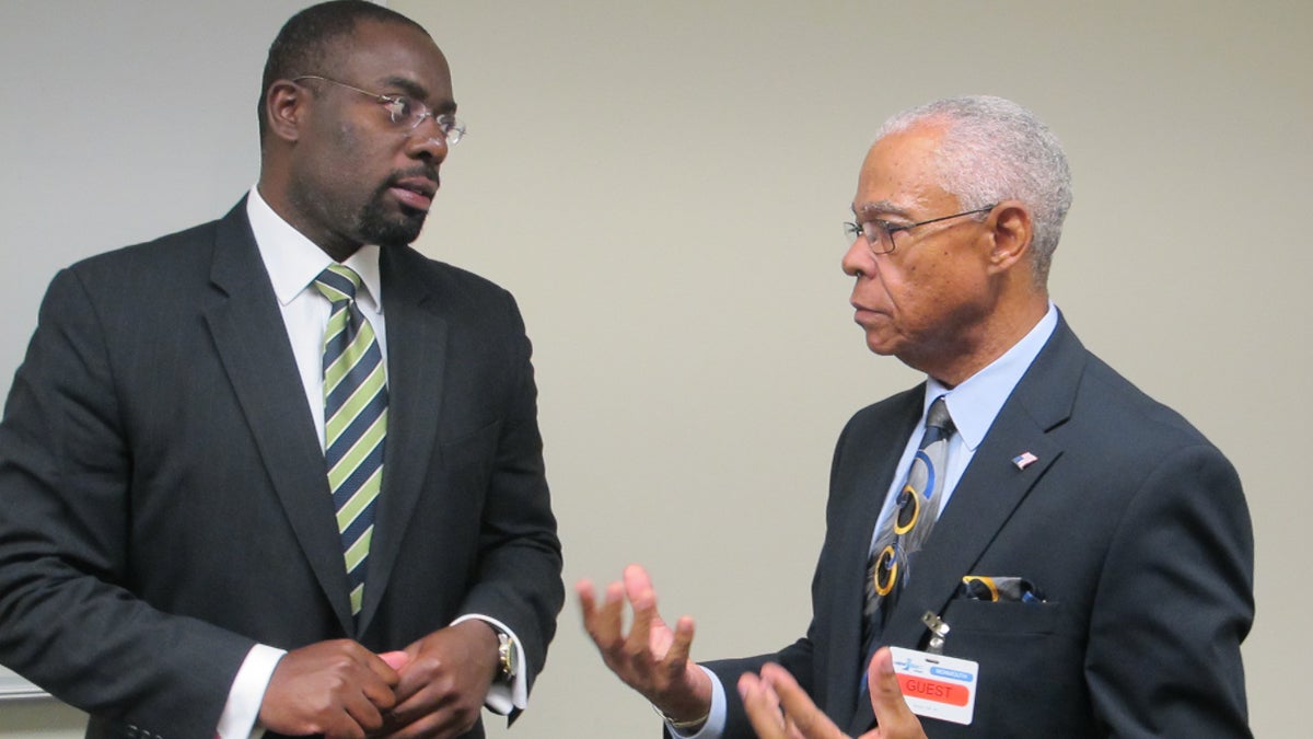  DCA Commissioner Richard Constable and OCEAN Inc. President Ted Gooding discuss the Landlord Rental Repair Program at the Housing Recovery Center in Freehold, N.J.  (Phil Gregory/WHYY) 