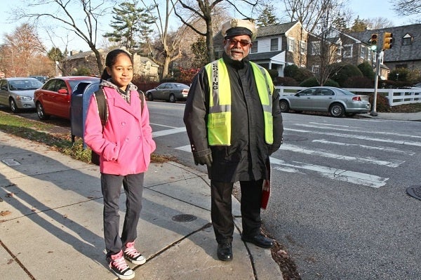 <p><p>Larry Abney, a crossing guard at Mifflin Elementary School, has become an East Falls neighborhood staple since he started working at a busy intersection eight years ago. (Kimberly Paynter/WHYY)</p></p>
