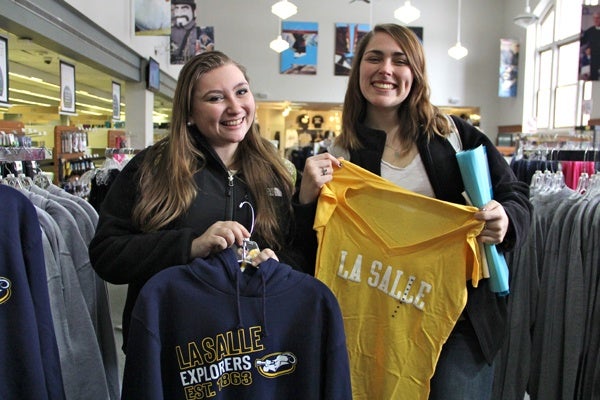 Heather Mengert and Erika Schellinger stock up on La Salle gear at the campus bookstore.
