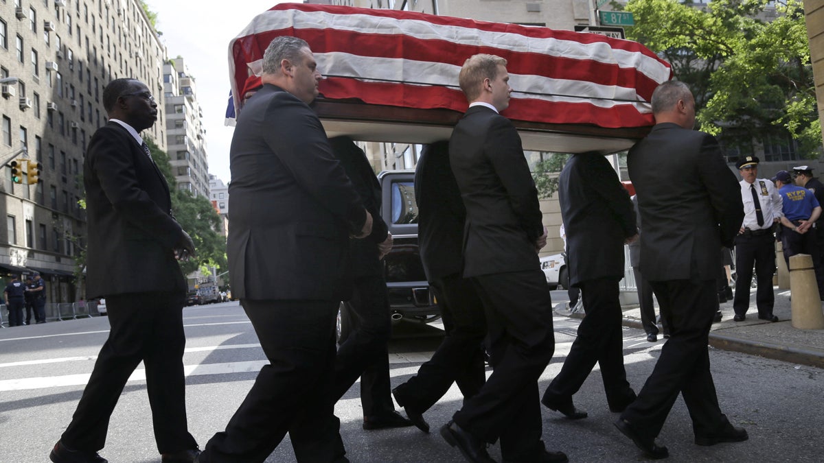 The casket containing the body of U.S. Sen. Frank Lautenberg is carried into the Park Avenue Synagogue in New York City on Wednesday. (AP Photo/Seth Wenig) 