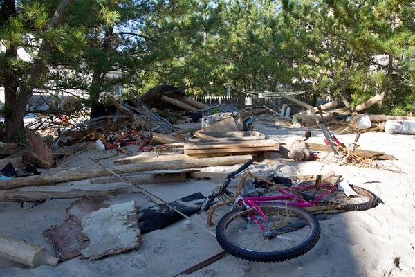 <p><p>Hurricane Sandy swept planks of wood and a bicycle into the backyard of a home in Beach Haven on Long Beach Island. (Lindsay Lazarski/WHYY)</p></p>
