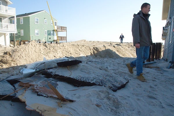 <p><p>Slabs of pavement ripped from a road, washed up next to a beachfront house on Long Beach Island after Hurricane Sandy. (Lindsay Lazarski/WHYY)</p></p>
