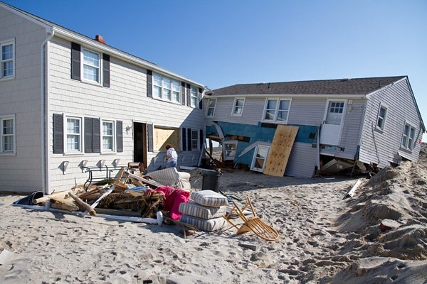 <p><p>Trish and Chandler Hosmer returned to their Long Beach Island home (left) on Sunday to begin to pick up the pieces after Hurricane Sandy. (Lindsay Lazarski/WHYY)</p></p>
