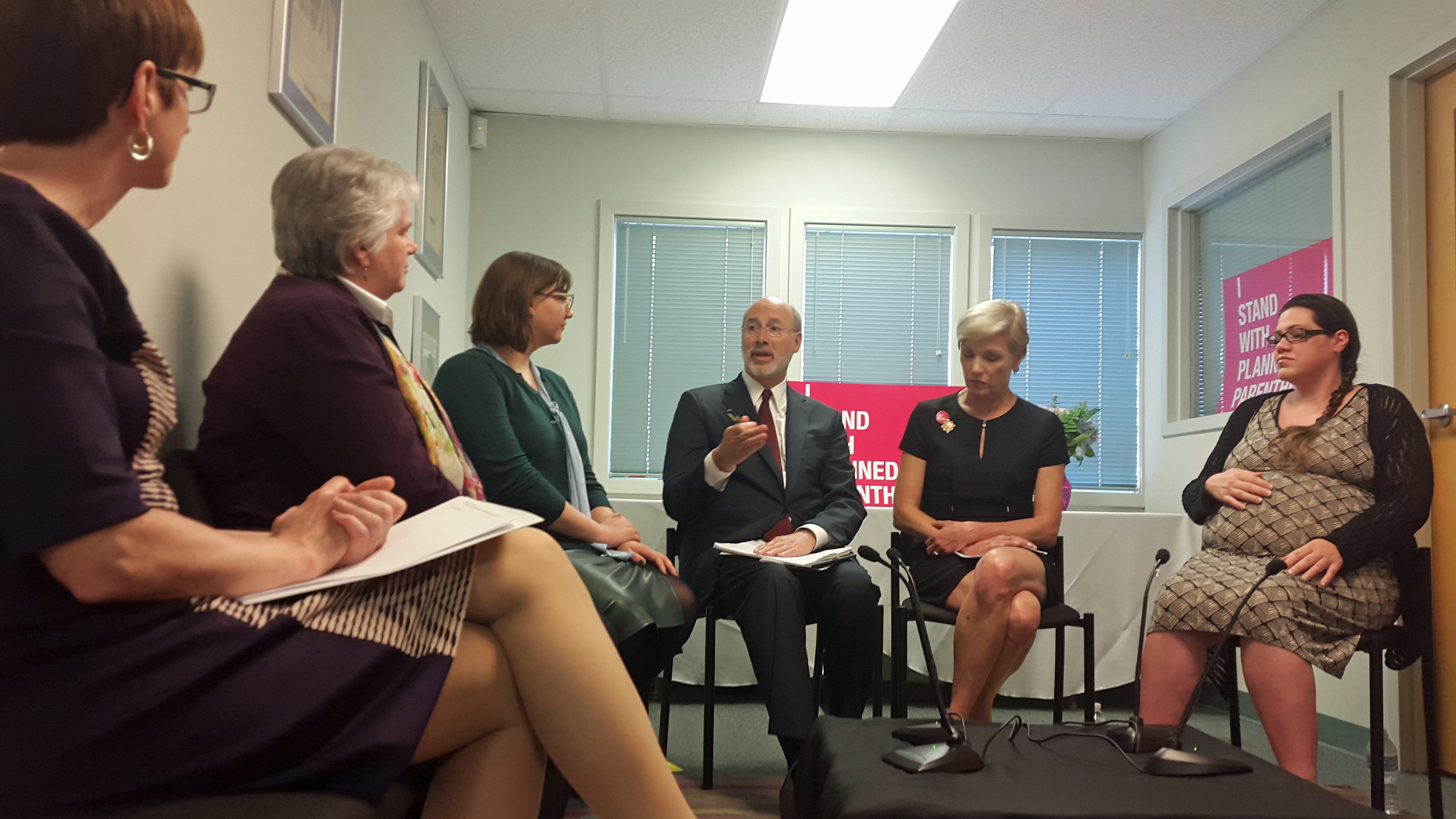  Governor Tom Wolf speaks at the Planned Parenthood in Warminster. He is seated next to PP President Cecile Richards. (Laura Benshoff/WHYY) 