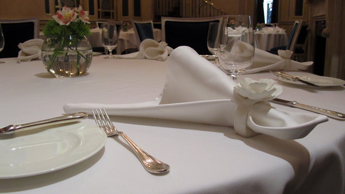  The tables in the dining room are set for lunch service. Lunch includes a choice of a la carte or prix fixe tasting menu. (Peter Crimmins/WHYY) 