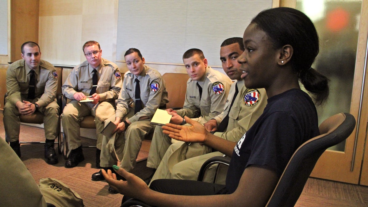 High School senior Jackie Grear shares her point of view on law enforcement with a group of recruits at the National Constitution Center. (Emma Lee/WHYY)