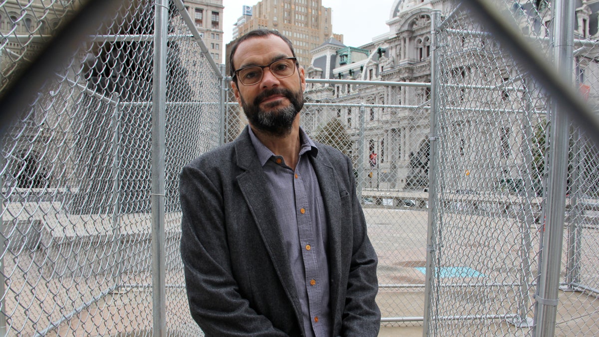 Los Angeles-based artist Sam Durant created Labyrinth, a chain-link maze, on Thomas Paine Plaza. The public is expected to fill the structure with their own responses to mass incarceration. (Emma Lee/WHYY)