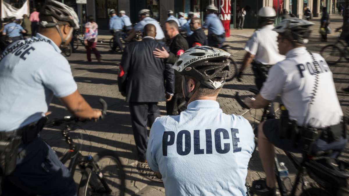  Philadelphia police escort a protest march near City Hall. (Branden Eastwood for NewsWorks) 