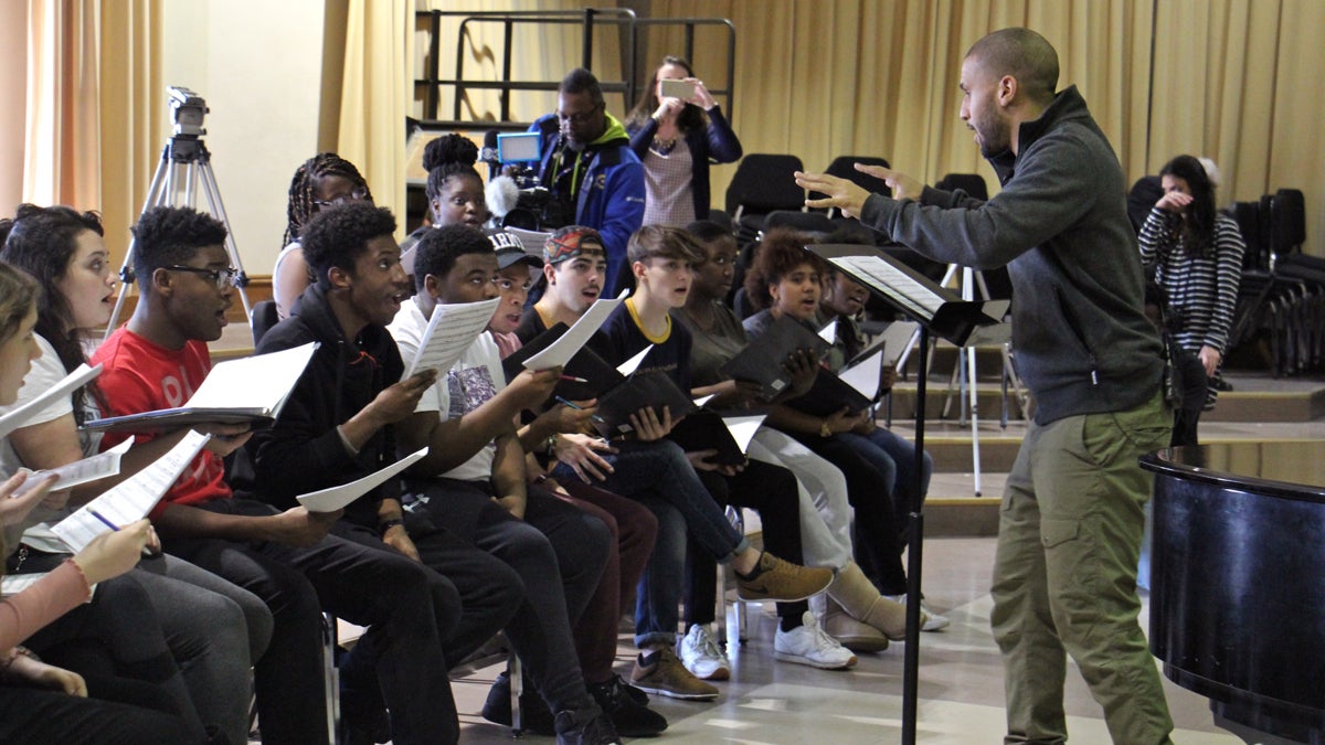 Sydney Harcourt, a member of the original cast of the Broadway musical ''Hamilton,'' practices with students at the Philadelphia High School of Creative and Performing Arts (CAPA) for a performance at the opening gala of the Museum of the American Revolution in April. (Emma Lee/WHYY)