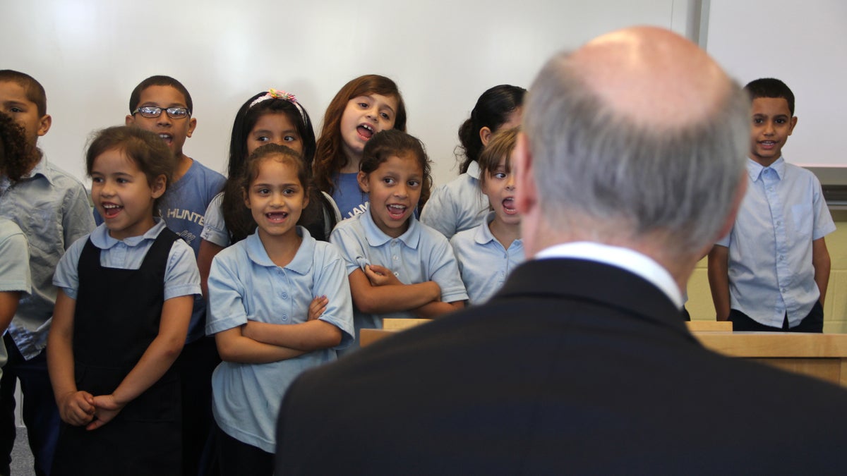 Second graders at William H. Hunter school sing Take Me Out to the Ballpark for Gov. Tom Wolf who visited their school to talk about his plan for funding public schools in Pennsylvania. (Emma Lee/WHYY)