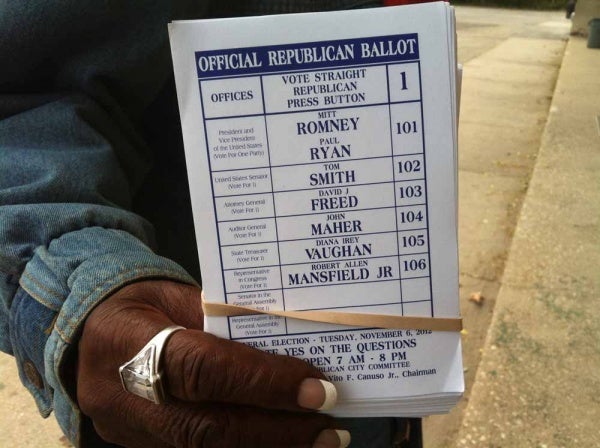 Sample ballots handed out on Germantown Avenue. (Kiera Smalls/for WHYY, file)