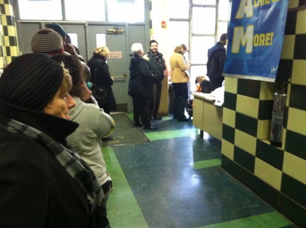 <p><p>The line was wrapped around the hall at Lingelbach Elementary at 7 a.m. on Tuesday. (Kiera Smalls/for NewsWorks)</p></p>
