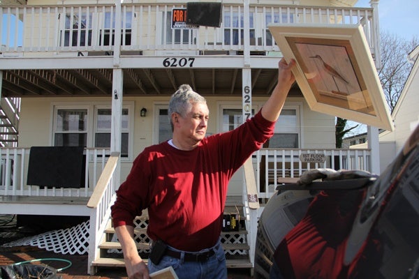 <p><p>Vince Contreras piles salvaged belongings into his pick-up truck at his beach home on Long Beach Boulevard in Long Beach, N.J. (Emma Lee/for NewsWorks)</p></p>
