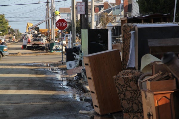 <p><p>Displaced and discarded appliances and furniture are piled at the curb at Sand Dune Lane and Long Beach Boulevard in Long beach, N.J. (Emma Lee/for NewsWorks)</p></p>
