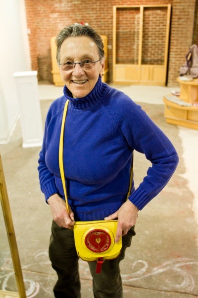 <p><p>Arlene Olshan shows one of her handmade leather bags, She has been making them for 45 years. (Brad Larrison/for NewsWorks)</p></p>
