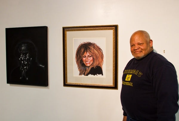 <p><p>Karl Hanson stands next to his portraits, one of Miles Davis (right) and the other of Tina Turner. He says he saw both as photographs in magazines and that, "they just said, paint me." (Brad Larrison/for NewsWorks)</p></p>
