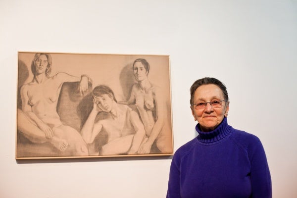 <p><p>Arlene Olshan stands next to a portrait of herself, her best friend and her partner from when they were in art school. Olshan titled it "Monumental." (Brad Larrison/for NewsWorks)</p></p>
