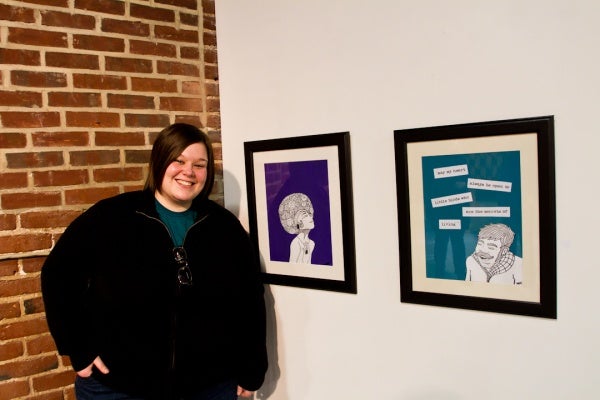 <p><p>Melissa Hamilton stands next to her literature-influenced cartoons, "Secrets of Living" (right), and "The World Was a Symphony." Hamilton is an English teacher by day but has been cartooning since she was a child. (Brad Larrison/for NewsWorks)</p></p>
