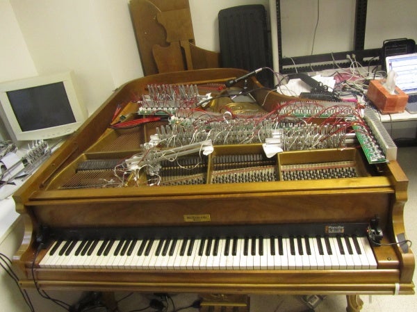 The electromagnet rigging is portable can be removed from the old, battered piano in Drexel's music and entertainment technology lab and reinstalled in a concert grand in a few hours. (Peter Crimmins/For NewsWorks)