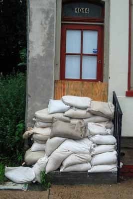  A house on Main Street along the Manayunk Canal prepares for the storm.  (Max Matza/for NewsWorks) 