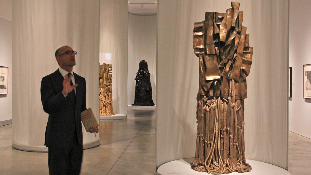  Carlos Bosualdo, curator of contemporary art at the Philadelphia Museum of Art, leads visitors through The Malcolm X Steles by Barbara Chase-Riboud. (Emma Lee/for NewsWorks) 