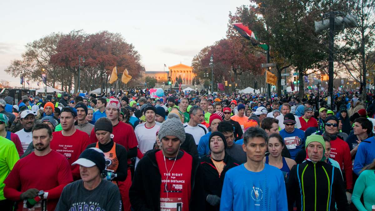 Waves of runners wait to begin The Philadelphia Marathon Sunday.