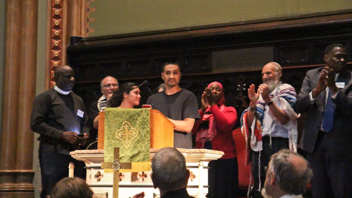 Javier Flores, originally from Mexico, has been in sanctuary at United Methodist Arch Street Church since November 2016, and receives standing ovation. (Kimberly Paynter/WHYY)