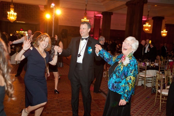 <p><p>2013 Charley and Peggy Roach award recipient Madge Keehn (right) dancing with her son, EFEPA board member Paul Keehn, and his wife, Abby (Photo courtesy of Photos by Jonathan Meter)</p></p>
