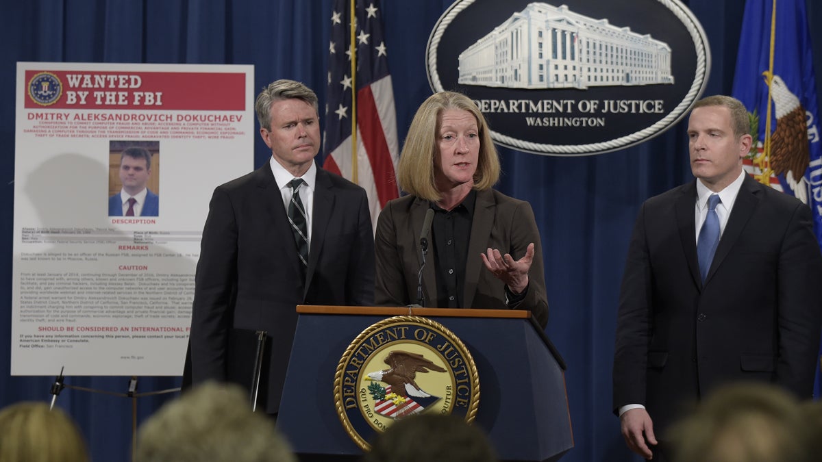  Acting Assistant Attorney General Mary McCord, center, accompanied by U.S. Attorney for the Northern District Brian Stretch, left, and FBI Executive Director Paul Abbate, speaks during a news conference at the Justice Department in Washington, Wednesday, March 15, 2017. The Justice Department announced charges against four defendants, including two officers of Russian security services, for a mega data breach at Yahoo. (AP Photo/Susan Walsh) 