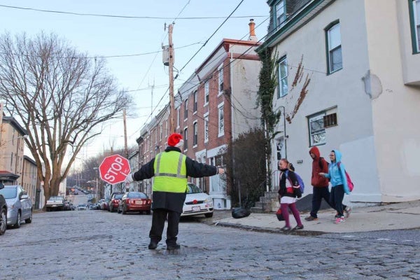 <p><p>Nominated Crossing Guard Mary Evans crosses children at the corner of Smick and Hermitage street in Manayunk. (Kimberly Paynter/WHYY)</p></p>
