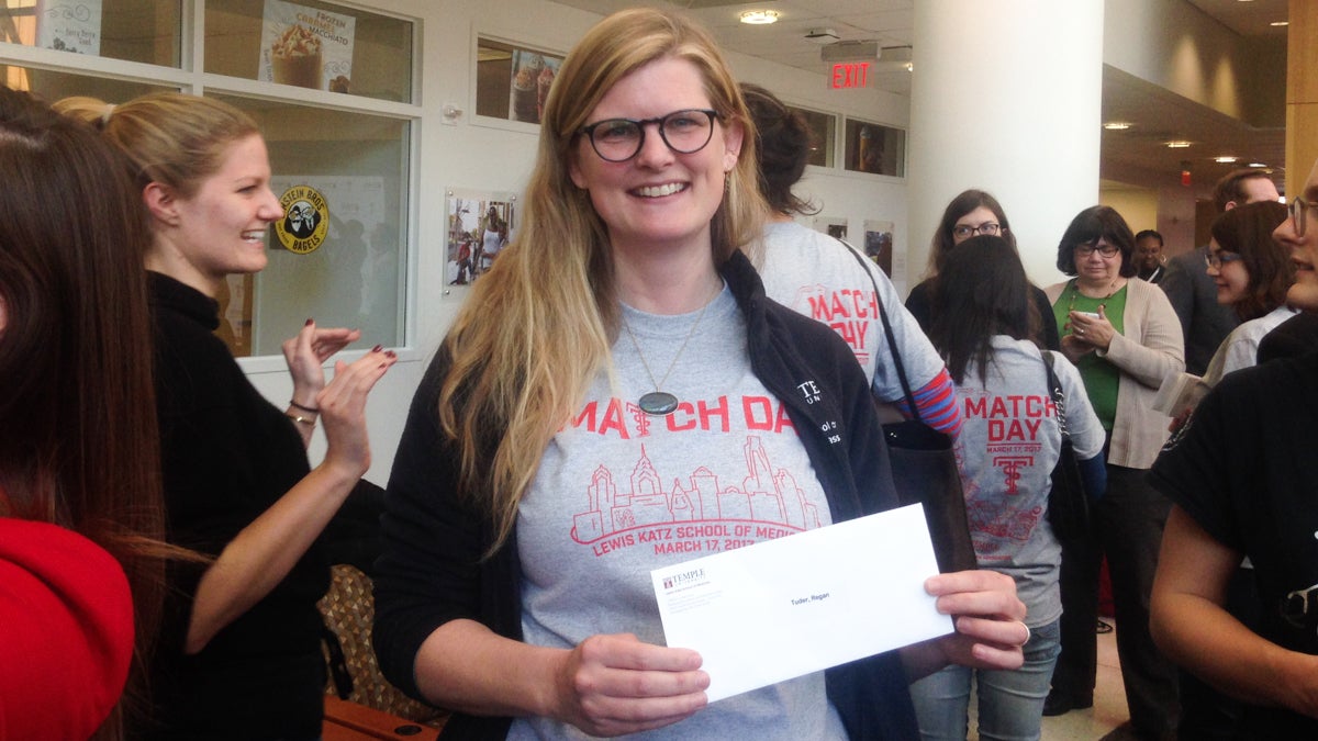 Medical student Regan Causey Tuder, age 43, holds the envelope that will reveal where she will do her residency.